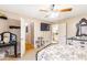 Comfortable bedroom featuring a ceiling fan, neutral walls, and access to an ensuite bathroom and closet at 7840 Highway 101, Rockmart, GA 30153