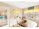 Sunlit breakfast nook with door to porch, views, round table, and yellow decor at 7840 Highway 101, Rockmart, GA 30153
