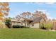 Charming home featuring a stone facade, lush lawn, and mature trees in a serene setting at 7840 Highway 101, Rockmart, GA 30153