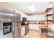 Modern kitchen with white cabinets, butcher block countertops, and stainless steel appliances at 7840 Highway 101, Rockmart, GA 30153