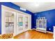Bright living room featuring access to the porch, blue accents, and stylish decor at 7840 Highway 101, Rockmart, GA 30153