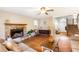 Inviting living room with a stone fireplace, hardwood floors, and natural light at 7840 Highway 101, Rockmart, GA 30153