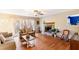 Cozy living room with hardwood floors, stone fireplace, and natural light at 7840 Highway 101, Rockmart, GA 30153