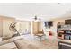 Spacious living room area with a ceiling fan, carpet floors, and access to a deck through glass doors at 7840 Highway 101, Rockmart, GA 30153