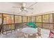 Inviting screened-in porch featuring comfortable seating and scenic views of the surrounding woods at 7840 Highway 101, Rockmart, GA 30153