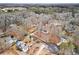 Wide aerial view of home on cul-de-sac in wooded neighborhood at 1925 Commonwealth Ct, Cumming, GA 30041