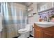 Charming bathroom featuring a vanity, toilet, and a shower with a decorative curtain at 1925 Commonwealth Ct, Cumming, GA 30041