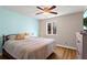Cozy bedroom with a queen-size bed, patterned bedding, and a bright window at 1925 Commonwealth Ct, Cumming, GA 30041