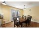 Bright dining room featuring a wooden table, chairs, and a view to the outdoors at 1925 Commonwealth Ct, Cumming, GA 30041
