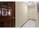 Hallway with tile flooring, a view into the home, and a door with a window at 1925 Commonwealth Ct, Cumming, GA 30041