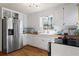 Beautiful kitchen featuring wood countertops, white cabinets, stainless steel appliances, and hardwood floors at 1925 Commonwealth Ct, Cumming, GA 30041