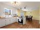 Well-appointed kitchen with a dining area, stainless steel appliances, and wood countertops at 1925 Commonwealth Ct, Cumming, GA 30041