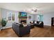 Cozy living room features a stone fireplace, hardwood floors, and neutral color scheme at 1925 Commonwealth Ct, Cumming, GA 30041