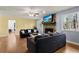 Inviting living room with hardwood floors, a stone fireplace, and stylish furnishings at 1925 Commonwealth Ct, Cumming, GA 30041