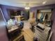 Bedroom with purple walls, ceiling fan, closet, desk, and light hardwood floors at 225 Nacoochee Dr, Woodstock, GA 30188
