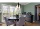 Breakfast nook with green walls, natural light, and a cozy dining space at 225 Nacoochee Dr, Woodstock, GA 30188