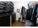 Walk-in closet featuring ample shelving, drawers, and hanging space for organized storage at 225 Nacoochee Dr, Woodstock, GA 30188