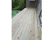 Spacious wooden deck with a pool view, perfect for outdoor entertaining and relaxation at 225 Nacoochee Dr, Woodstock, GA 30188