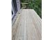 Wooden deck, offering a private outdoor space with access to the surrounding greenery at 225 Nacoochee Dr, Woodstock, GA 30188
