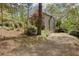 Long paved driveway leading to a home with lush greenery, providing privacy at 225 Nacoochee Dr, Woodstock, GA 30188
