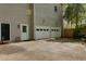 Exterior angle of the home's two-car garage with white doors and side door at 225 Nacoochee Dr, Woodstock, GA 30188