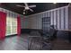 Home office featuring bold wallpaper, black painted ceiling and trim, and modern office furniture at 225 Nacoochee Dr, Woodstock, GA 30188