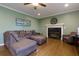 Comfortable living room showcasing a gray sectional sofa and fireplace, perfect for relaxation at 225 Nacoochee Dr, Woodstock, GA 30188