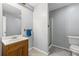 Bathroom with wood vanity, tile flooring and shower at 24 Picketts Mill Pl, Acworth, GA 30101
