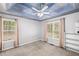 Bedroom with a ceiling fan, two windows, and a sky painted on the ceiling at 24 Picketts Mill Pl, Acworth, GA 30101