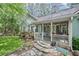 Cozy front porch with stone steps, comfortable seating, and decorative elements at 24 Picketts Mill Pl, Acworth, GA 30101