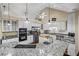 Well-equipped kitchen featuring granite countertops, stainless appliances, and ample cabinet space at 24 Picketts Mill Pl, Acworth, GA 30101
