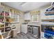 Functional laundry room with washer, dryer, shelving, and storage space for convenience at 24 Picketts Mill Pl, Acworth, GA 30101