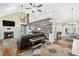Spacious living room with a fireplace, hardwood floors, and stylish decor at 24 Picketts Mill Pl, Acworth, GA 30101