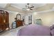 Spacious primary bedroom featuring a tray ceiling and ensuite bathroom access at 24 Picketts Mill Pl, Acworth, GA 30101