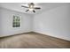 Bedroom with bright window and wood floors at 3182 Wakefield Dr, Decatur, GA 30034