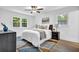 Inviting bedroom featuring neutral decor, soft carpet, and a ceiling fan for added comfort at 3182 Wakefield Dr, Decatur, GA 30034