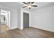Empty bedroom features wood floors, ceiling fan, and a closet at 3182 Wakefield Dr, Decatur, GA 30034