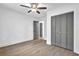Clean bedroom with ceiling fan, wood floors, and closet at 3182 Wakefield Dr, Decatur, GA 30034