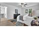 Bright bedroom boasts wood floors, ceiling fan, closet, and black dresser at 3182 Wakefield Dr, Decatur, GA 30034