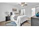 Bright bedroom features a cozy bed with neutral bedding, dark wood nightstands, and a ceiling fan at 3182 Wakefield Dr, Decatur, GA 30034