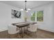 Elegant dining room with modern lighting, stylish art, and comfortable seating at 3182 Wakefield Dr, Decatur, GA 30034