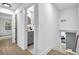 Hallway view leading to a bathroom featuring a modern vanity and fixtures at 3182 Wakefield Dr, Decatur, GA 30034