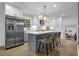 This kitchen features a center island with seating, stainless steel appliances, and sleek gray and white cabinetry at 3182 Wakefield Dr, Decatur, GA 30034