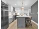This kitchen features a center island, modern light fixtures, and stainless steel appliances at 3182 Wakefield Dr, Decatur, GA 30034