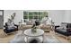 Bright living room featuring stylish furniture, a large window, and a modern rug at 3182 Wakefield Dr, Decatur, GA 30034