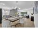 This open floor plan features a dining room and a living room with modern furniture and decor at 3182 Wakefield Dr, Decatur, GA 30034