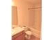 Well-lit bathroom with a tub and shower combination and a vanity with storage at 615 Magnolia Gardens Walk, Mcdonough, GA 30253