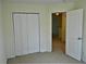 Bedroom with closet and doorway to hallway at 615 Magnolia Gardens Walk, Mcdonough, GA 30253