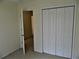 Bedroom with door and closet at 615 Magnolia Gardens Walk, Mcdonough, GA 30253