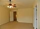 Bedroom with carpet, ceiling fan, and ensuite bathroom at 615 Magnolia Gardens Walk, Mcdonough, GA 30253